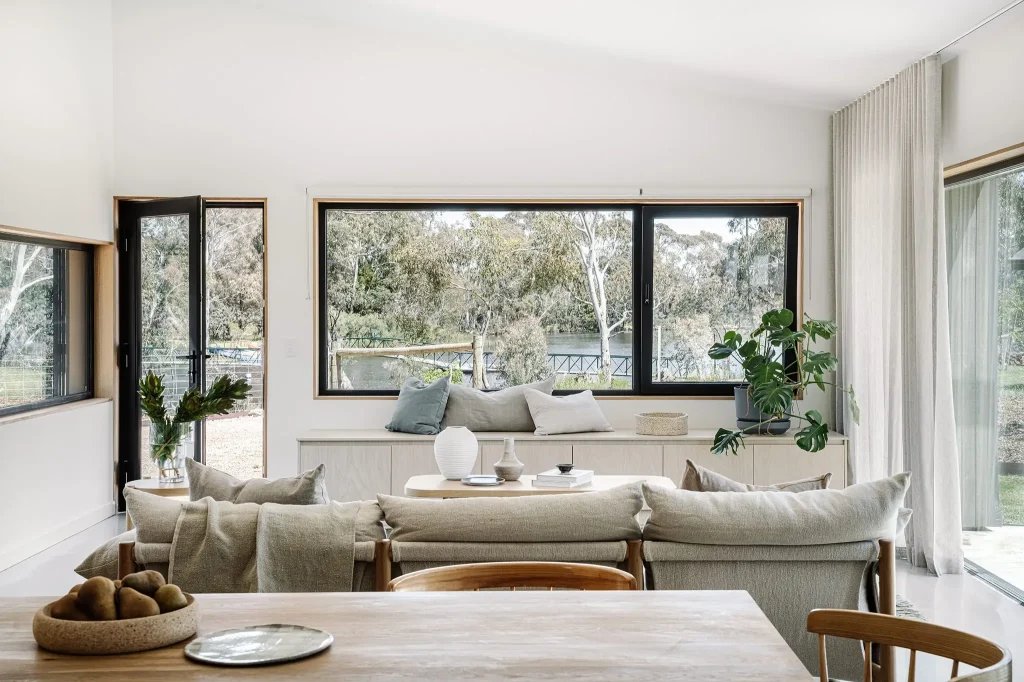 Bright living room with black-frame replacement windows